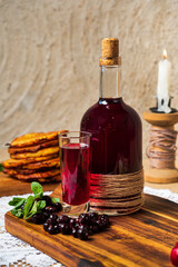 berry tincture on the wooden board