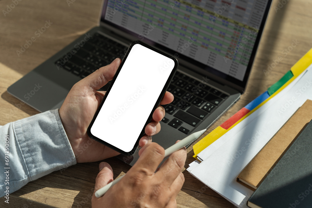 Poster top view mockup image hand using a smartphone man holding cell phone with blank screen