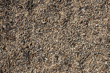 Close-up shot with gravel stones, pebbles as a background.
