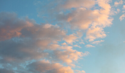 Naklejka na ściany i meble Colorful clouds on the blue sky at sunset