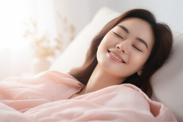 Fototapeta premium Happy Asian woman sleeping in cozy bed at home