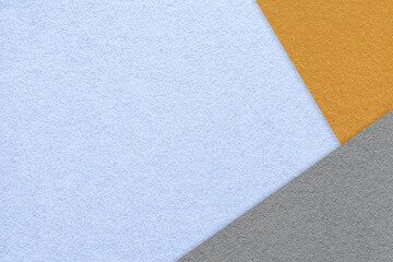 Texture of craft light blue color paper background with orange and gray border. Vintage abstract...