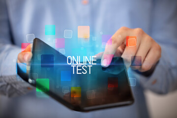 Young man holding a foldable smartphone