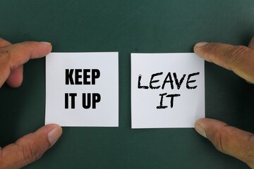 white ketas with two word options, namely keep it up or leave it. the concept of take it or leave...