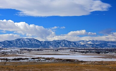 the  striking boulder flatirons and  snow -capped peaks of the front range of the colorado rocky...