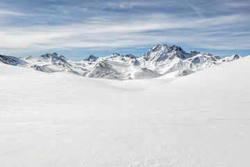 Fototapeta na wymiar Snowy mountains in the Austrian Alps. Ski resort in winter.
