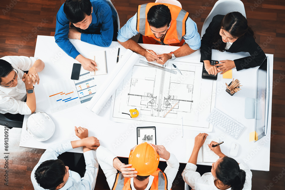 Poster Top view banner of diverse group of civil engineer and client working together on architectural project, reviewing construction plan and building blueprint at meeting table. Prudent