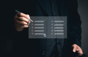 Questionnaire concept Online document management. DMS. Businessman checks list at virtual screen. Answering questionnaires about satisfaction Work via mobile phone or laptop. Satisfaction quality.