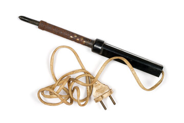 Old electric soldering iron with wire on white background. Close-up of soldering iron.