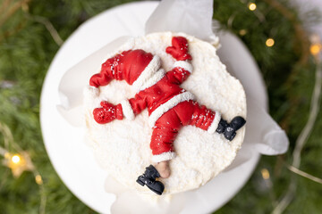 Funny Christmas cake. Merry Christmas to you. Happy Santa Claus. Delicious strawberry cake