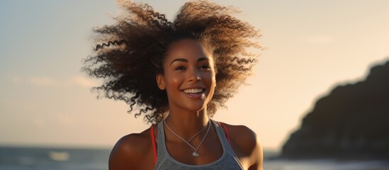 A black woman enjoys running by the sea for fitness, happiness, and health.