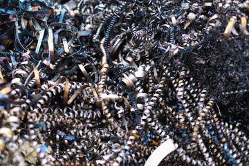 A monochromatic sea of industrial debris, illustrating the inevitable waste generated from metal...