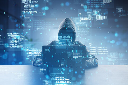 Front view of hacker using laptop at desk with creative binary coding hologram on blurry background. Software programming code and hacking. Double exposure.