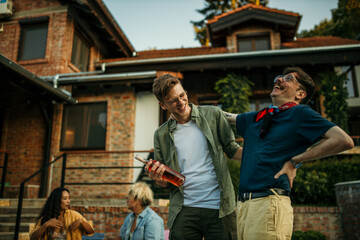 Friends from different backgrounds sipping on drinks, enjoying a relaxed poolside hangout under the sun