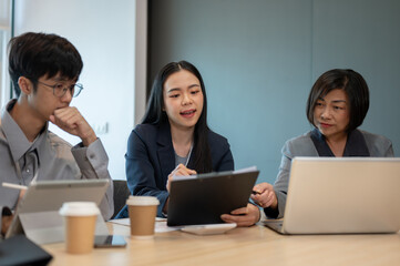 Group of diverse Asian businesspeople are in the meeting, planning their project strategies together