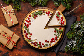 Christmas cake adorned with berries and rosemary