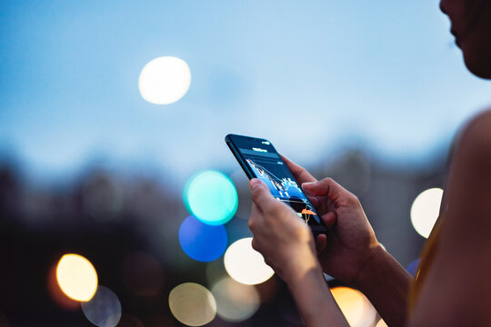 Business woman using smartphone to watch stock market