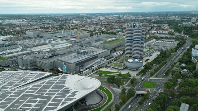 Towering above city skyline, automobile manufacturer BMW corporate building
