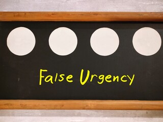 Chalkboard with text written False Urgency - unproductive busyness that doesn’t lead to...