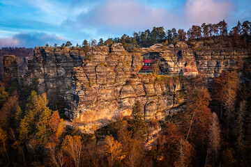 Hrensko, Czech Republic - Aerial view of the beautiful Pravcicka Brana (Pravcicka Gate) in Bohemian Switzerland National Park, the biggest natural arch in Europe on an warm autumn morning at sunrise
