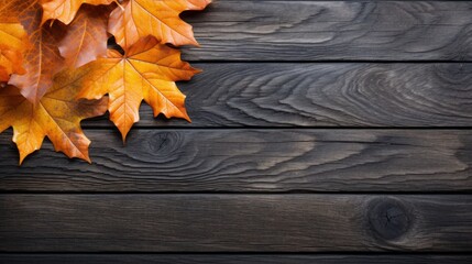 Naklejka na ściany i meble Autumn leaves on a black wooden table Orange leaves on an old wooden deck Copy location tablet for text