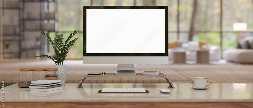 Aufkleber a computer mockup on a computer stand with accessories on a table in a modern spacious living room.