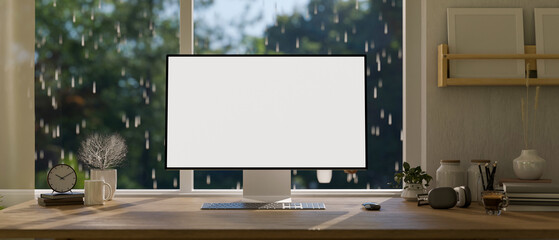 Home workspace with a computer desk against the window on a rainy day, A computer screen mockup