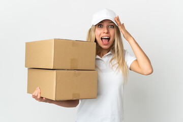 ¬°Young delivery woman isolated on white background with surprise expression