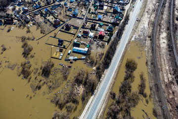 Aerial view of village areas with houses flooded during a rural spring river flood