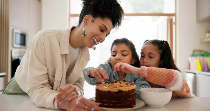 Happy family, kid and decorating of cake in kitchen for party, birthday or celebration with smile. Mother, children and excited for delicious, snack or dessert with candy for bond in relationship