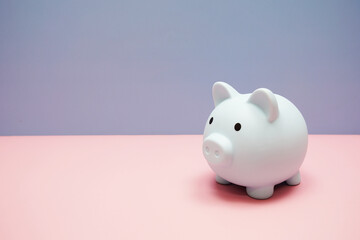 Piggy banks saving with space copy on pink background