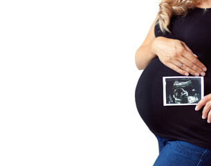Pregnant woman holding ultrasound baby image. Concept of pregnancy, gynecology, medical test, maternal health.