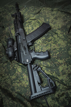 Modern assault rifle ak12 close-up, vertical photo.