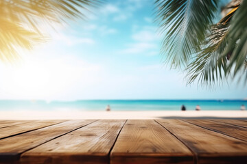 Empty wooden table and palm leaves with party on beach blurred background and beautiful sea 