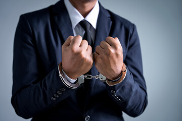 Being arrested for breaking the law, Businessman being handcuffed, demanding bribes for business benefits, offenses in public and private organizations must be prosecuted by law