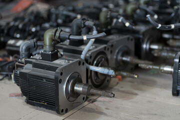 Electric motor in storage warehouse. Parts of electric motor in warehouse. Industrial business and...