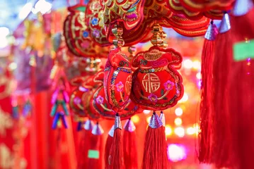 Foto auf Leinwand many decorations as symbol of wealth in the market for Tet Lunar New Year © Tatiana