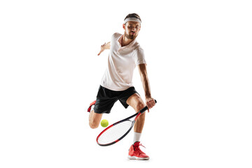 Competitive man, tennis player during game in motion, hitting ball with racket, playing isolated...
