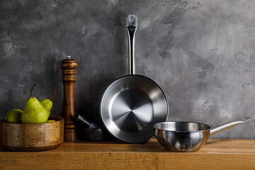 Steel frying pans in the kitchen