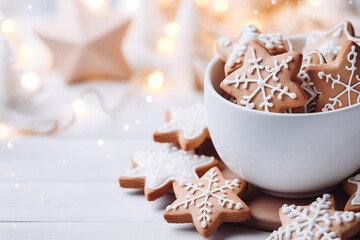 Gingerbread cookie  with a hot coffee for Christmas holiday. Hot winter drink: chocolate with whipped cream in blue mug. Christmas time. Cozy home atmosphere, white background