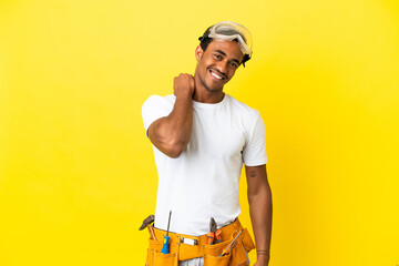 African American electrician man over isolated yellow wall laughing