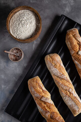 baked baguettes on a tray in the kitchen