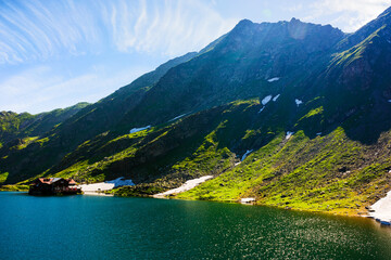 mountainous summer landscape of romania. green scenery of balea lake in carpathian fagaras ridge on...