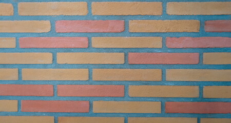 Stone wall made of rectangular bricks closeup. Building texture background