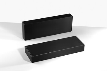 Mockup of black shallow boxes of smooth cardboard without logo