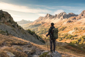 Male hiker hiking with enjoying the French Alps scenic on autumn wilderness in Claree Valley at France