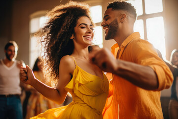 Afro american and caucasian dancers dancing in the dancing school, smiling. Relaxed atmosphere, couples teaching how to dance with instructor.