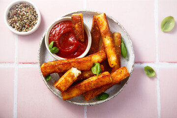 Traditional roasted halloumi cheese with tomato sauce