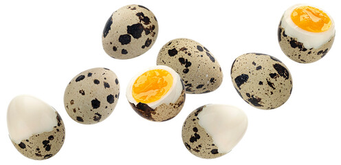 Falling quail eggs isolated on white background