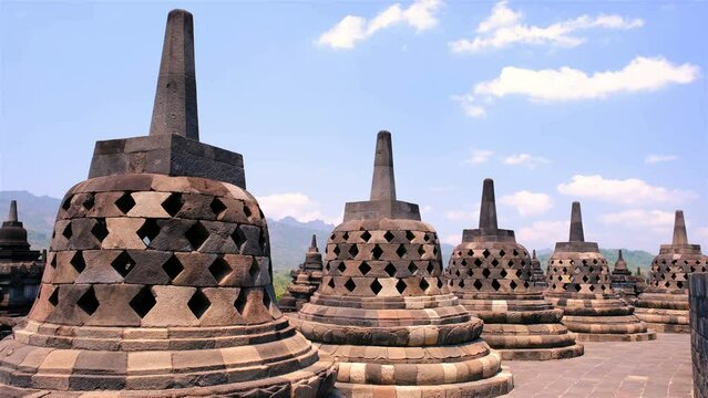 Ancient Buddhist temple Borobudur, built in the 9th century as a huge mandala - shaped stupa in Yogyakarta, Indonesia. Time lapse